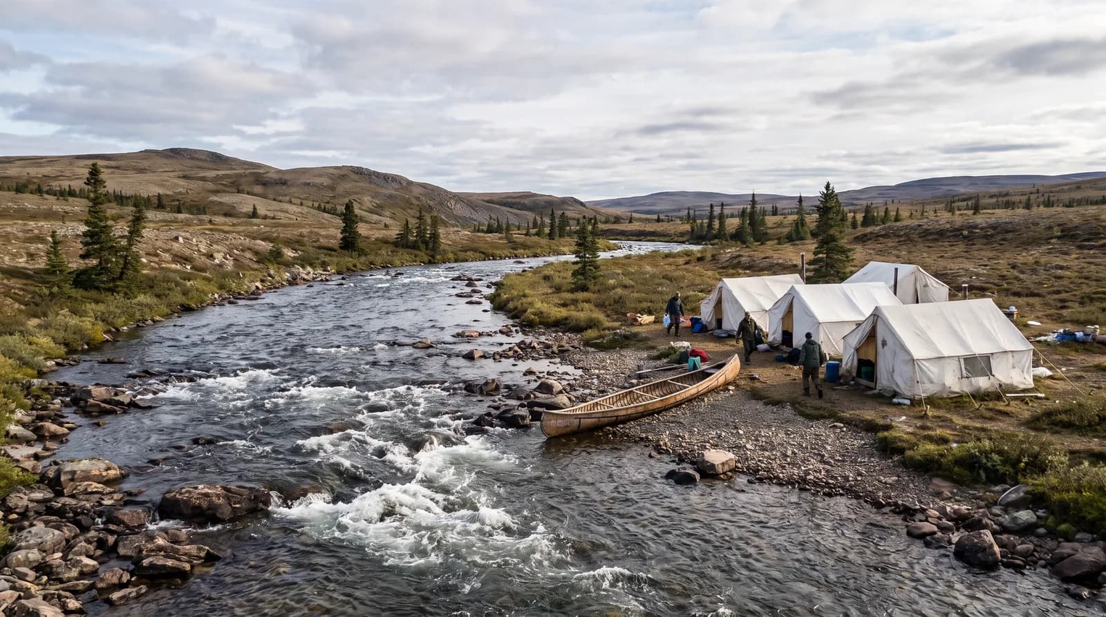 Remote Labrador river with a fishing camp of wall tents and a boat on shore